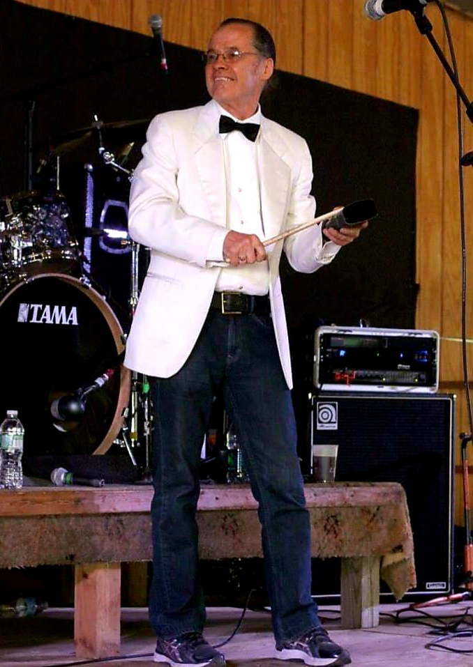 Peter McKiernan dressed up on stage